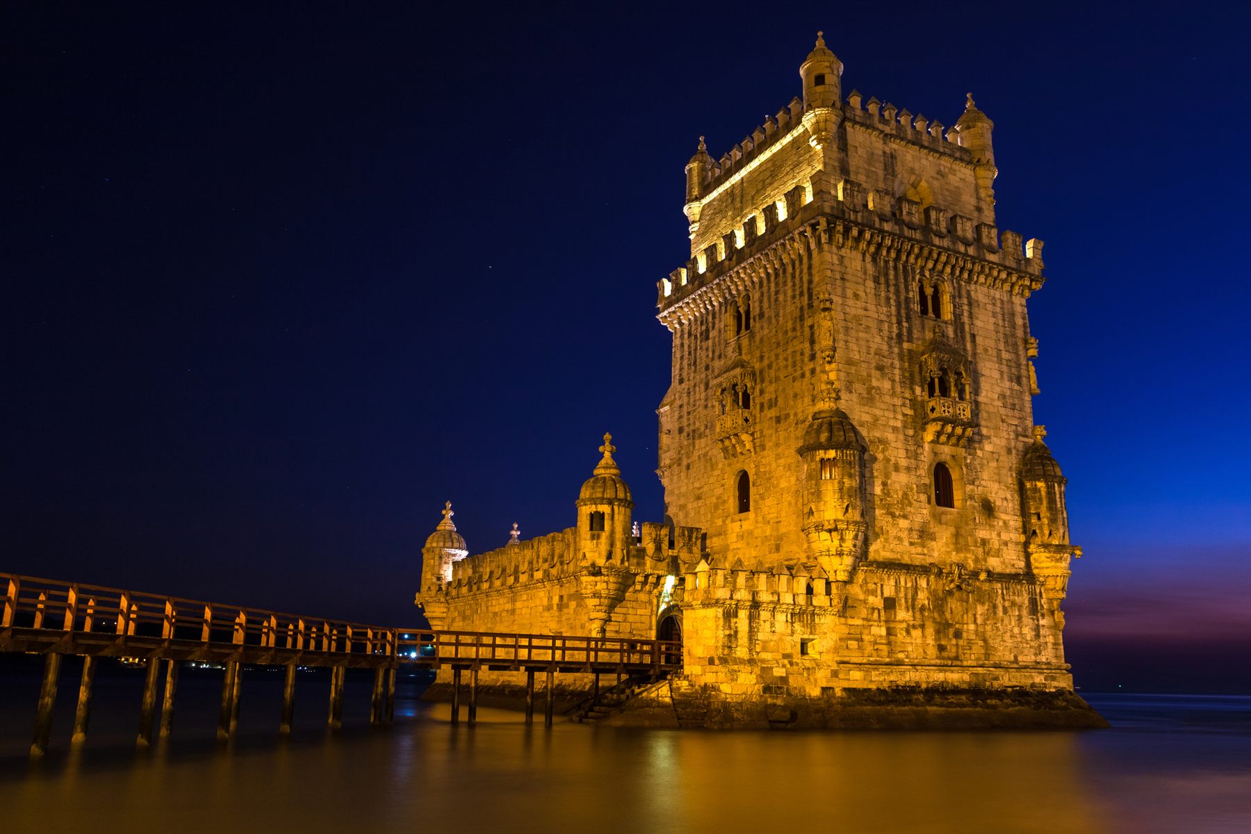 The Belém Tower on the Tagus in Lisbon, Portugal, lit up at night